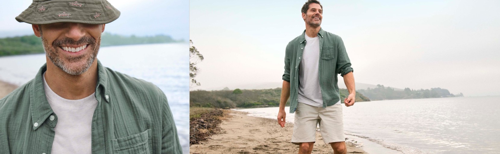Smiling man wearing a white T‑shirt layered under an open, green button-up shirt walking outdoors near water.
