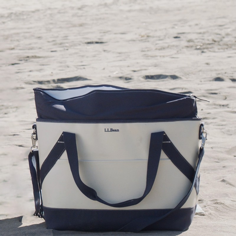 An insulated tote on the sand.