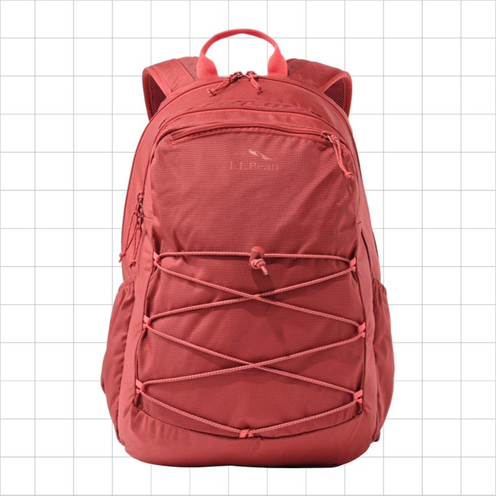 A salmon school backpack with a criss-cross cord strap on the front.