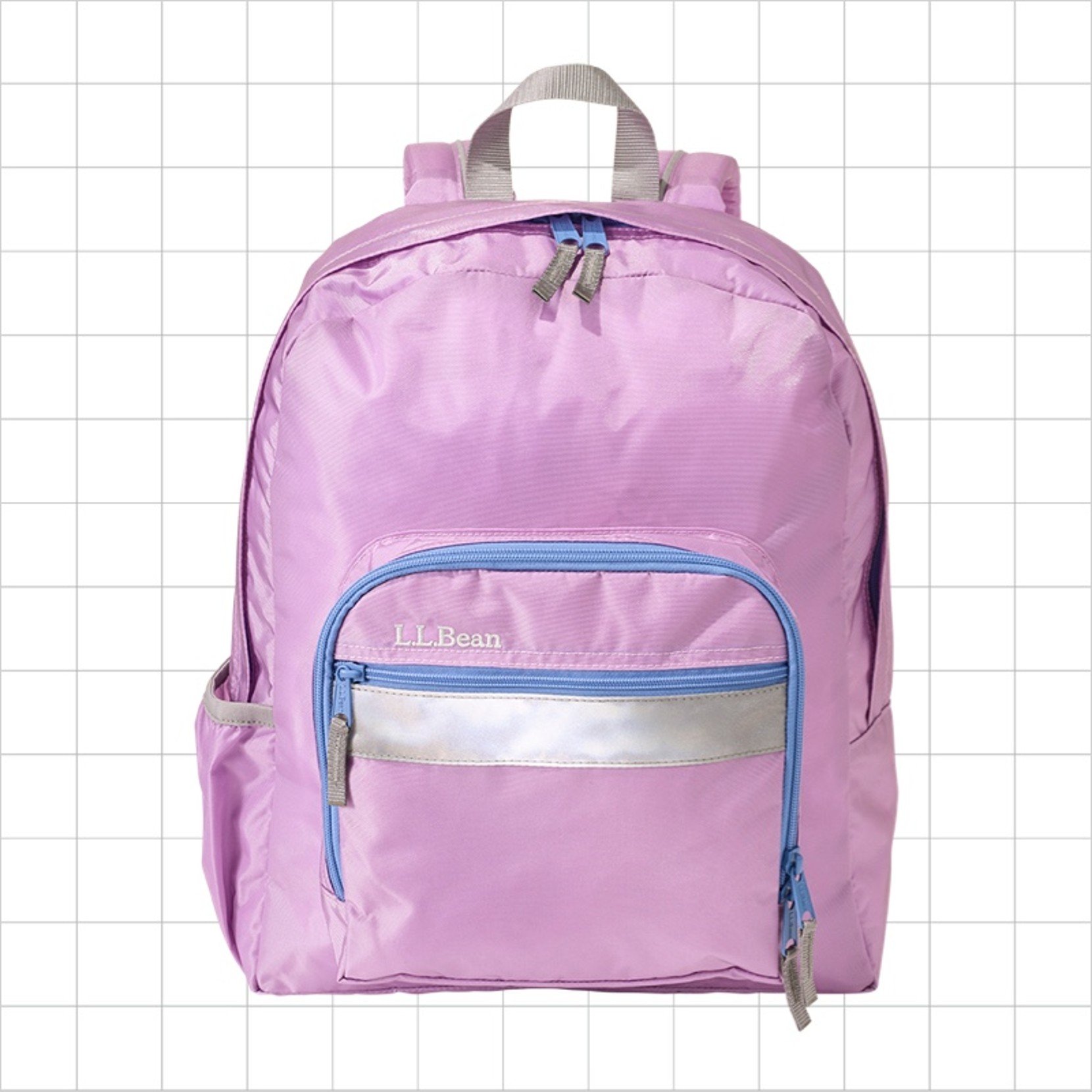 A pink school backpack with a reflective strip on the front pocket.