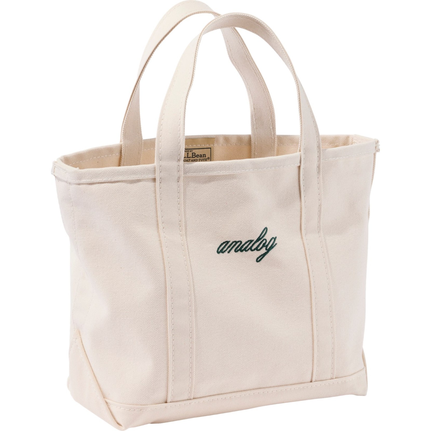 White canvas Boat and Tote bag with a green "Analog" monogram.