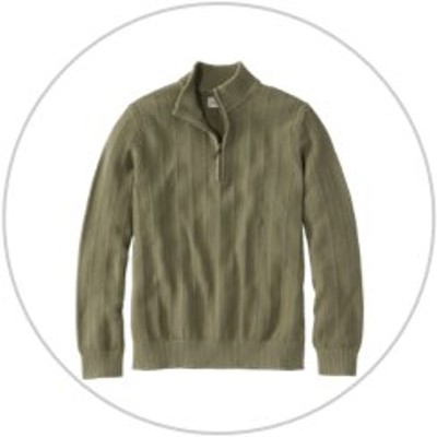 A quarter-zip sweater inside a light gray circle.