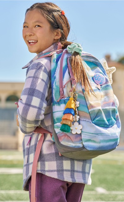A girl wearing a Comfort Carry Laptop Pack.