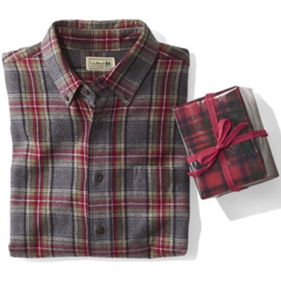 Image a folded man’s flannel shirt with a small holiday gift next to it