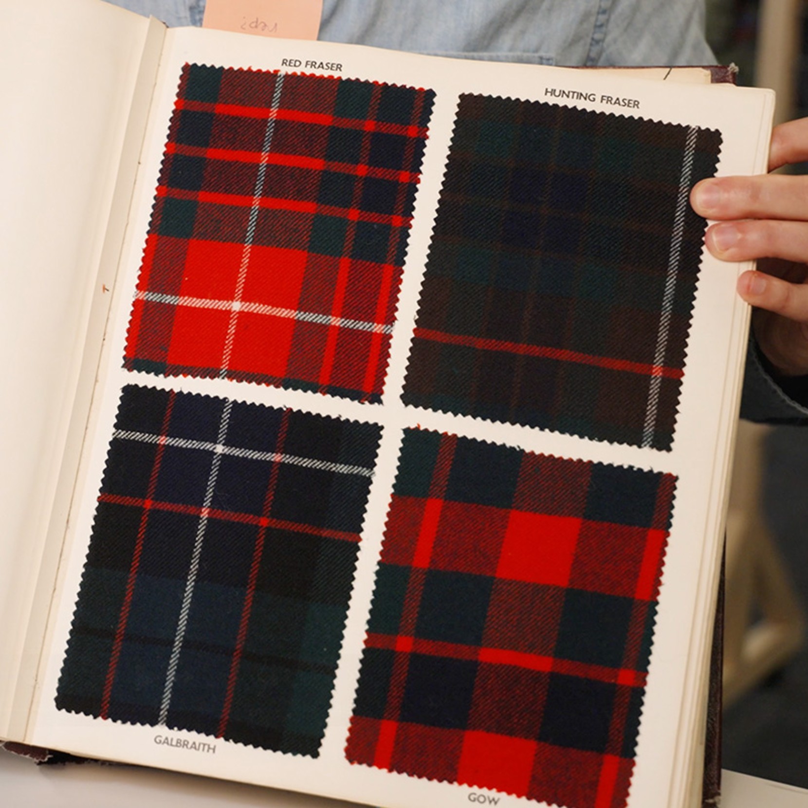 Tartan fabric samples labeled Red Fraser, Hunting Fraser, Galbraith, and Gow, each with distinct red and dark plaid patterns.