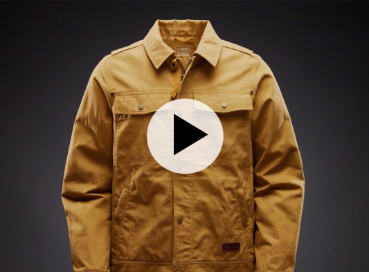 A Utility Puffer Jacket with a Play Video button in the center.