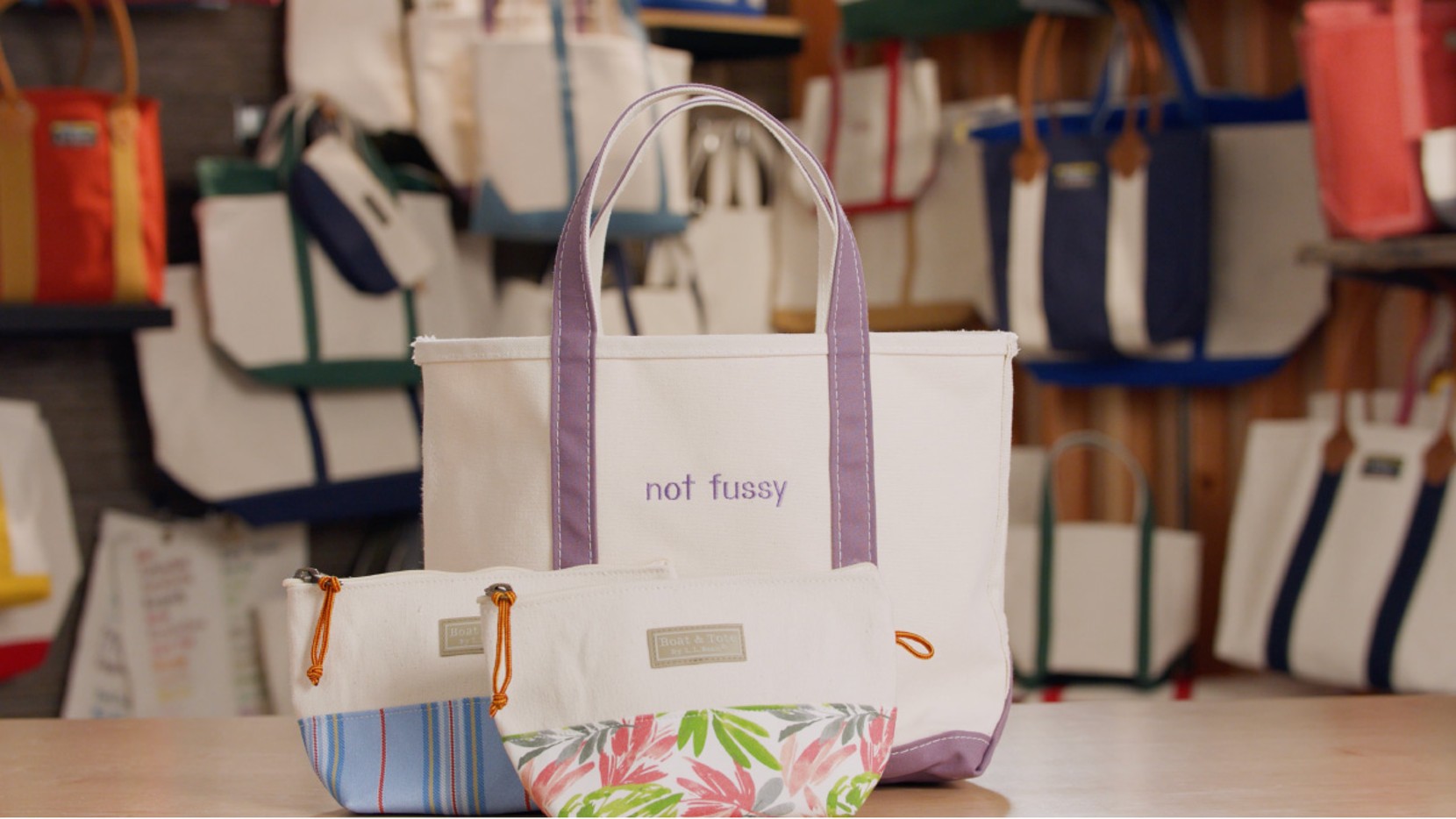 A Boat & Tote with lavender handles and monogram - not fussy, and 2 Boat & Tote Zip Pouches.