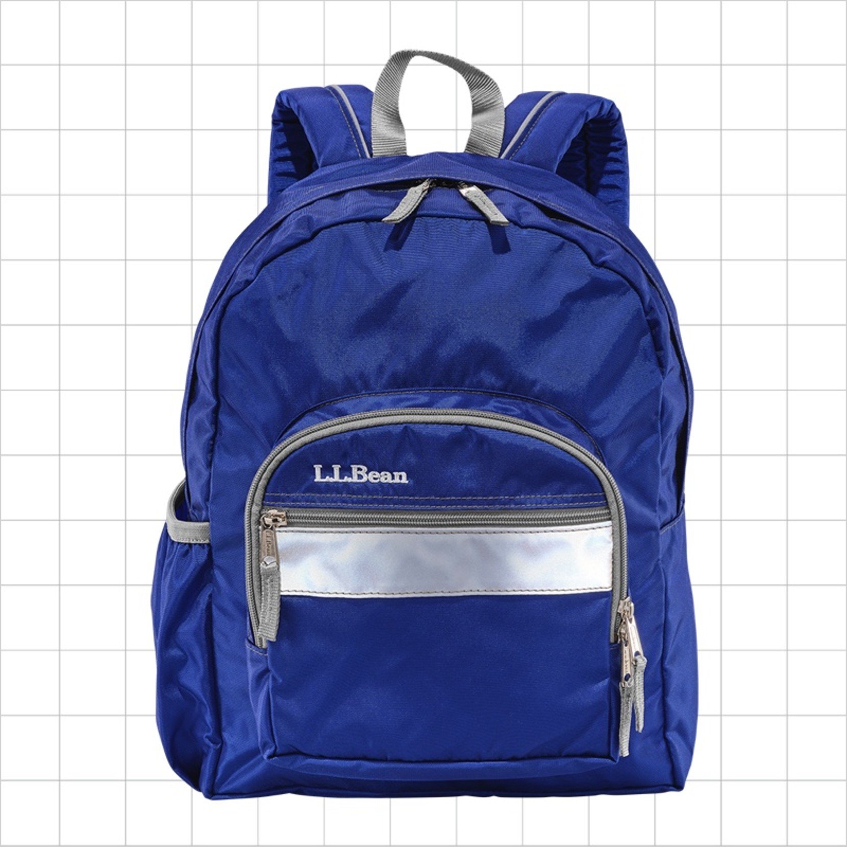 A royal blue school backpack with a reflective strip on the front pocket.